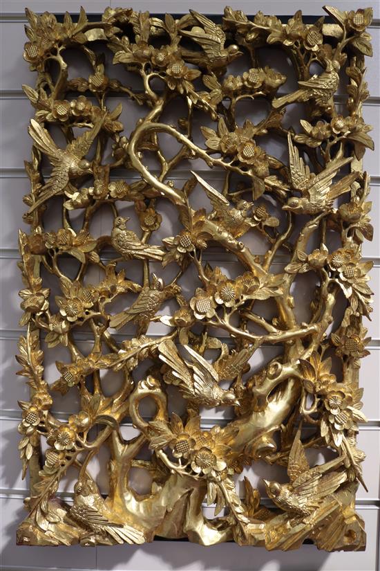 A set of six Chinese carved giltwood panels of birds amid prunus